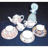 A Royal Crown Derby miniature porcelain tea set,