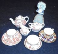 A Royal Crown Derby miniature porcelain tea set,