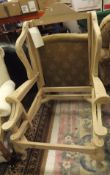 A pair of beech framed wing back armchair frames with cabriole legs with shell carving to the knees