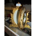 A Victorian brass and Pietra dura photograph frame of oval form,