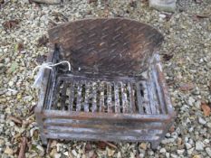 A cast iron fire basket