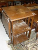 An early 20th Century oak revolving bookcase with reading slope