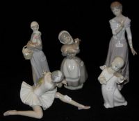 A Nao figure of girl carrying lamb, Lladro figure of seated ballerina,