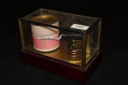 A modern Bray Developments Company barograph in glass case