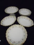 A Limoges dessert service comprising twelve plates, tazza,