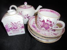 A Meissen part tea service with puce and gilt floral spray decoration on a ribbed body comprising