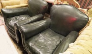 Two armchairs in dark green leather upholstery with serpentine fronted seats,