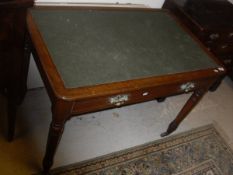 A Victorian oak writing table,