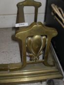 An early 20th Century brass fire curb in the Art Nouveau taste