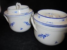 A pair of 19th Century French blue and white floral spray decorated ice pails with dished tops,