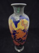 A Gouda pottery vase polychrome decorated with autumnal leaves, inscribed "Tiny Gouda ...