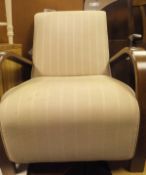 A Laura Ashley armchair in the 1930's manner with cream upholstered seat and back,