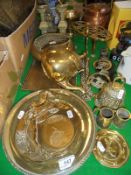 A selection of brass and copper wares, a brass door porter in the form of a lion's foot,