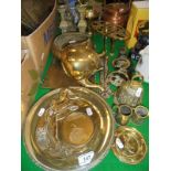 A selection of brass and copper wares, a brass door porter in the form of a lion's foot,