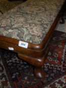 An early 20th Century upholstered long footstool to six cabriole legs to pad feet