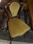 A set of five Victorian rosewood framed chairs with yellow velvet upholstered plush seat and back,