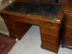 An early 20th Century oak pedestal desk,