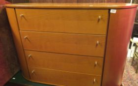 A 20th Century pinched oval shaped bedroom chest by Vittoria of four drawers,