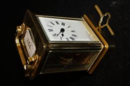 A circa 1900 French lacquered brass cased carriage clock,