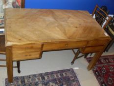 An early 20th Century Art Deco five drawer desk,