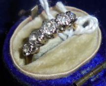 An 18 carat gold mounted graduated five stone diamond ring, approx 0.