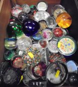 A collection of paperweights to include millefiori paperweights,