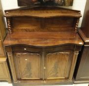 A Victorian mahogany chiffonier with architectural pediment and a top shelf supported by