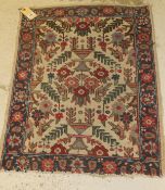 A Tabriz rug, the central panel set with all over bird and floral motifs on a cream ground,