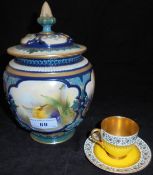 A Royal Worcester Hadley ware pot pourri vase and cover decorated with daffodils and spring flowers,