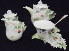 A collection of Franz Porcelain "Ladybug" pattern china wares to include cream jug, sugar jar,