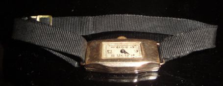 An early 20th Century ladies 9 carat gold cased wristwatch, the silvered dial with Arabic numerals,