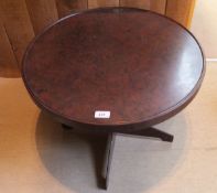 A circa 1930 Bakelite coffee table with circular top to quadruped base