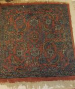 A Mahal rug, the central panel set with all over stylised floral decoration on a pink ground,