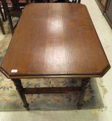 A Victorian teak folding table, raised on turned and ringed legs,