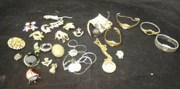A collection of various costume jewellery, watches, brooches,
