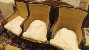 A pair of modern stained beech framed armchairs in the Empire taste,