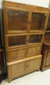 An early 20th Century Globe Wernicke type oak four section bookcase cabinet with Art Deco style
