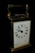 A circa 1900 French lacquered brass cased carriage clock,