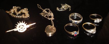 A selection of various gold jewellery including three various rings,