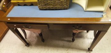 An early 20th Century mahogany two drawer writing table,