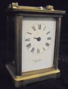 A circa 1900 French lacquered brass cased carriage clock by R & Co.