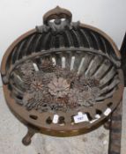 A cast iron fire basket of shell form