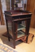 A Victorian mahogany bijouterie cabinet in the Chippendale taste,