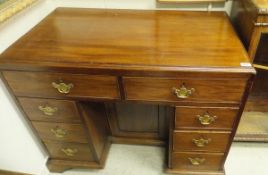 An early 19th Century mahogany knee-hole desk,