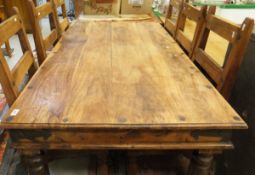 An Eastern hardwood rectangular dining table and six ladder-back panel seat dining chairs,