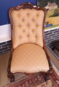 A Victorian salon chair with rosewood frame with pale gold self patterned upholstered back and seat