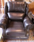 A three seat sofa and a single arm chair in brown leather upholstery
