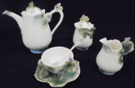 A Franz Porcelain "Frog" teapot, cup and saucer,