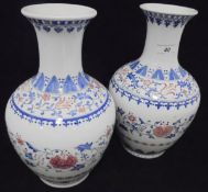 A pair of modern Taiwanese polychrome decorated vases wtih floral spray decoration