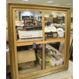A large gilt and gesso picture frame with beaded edge